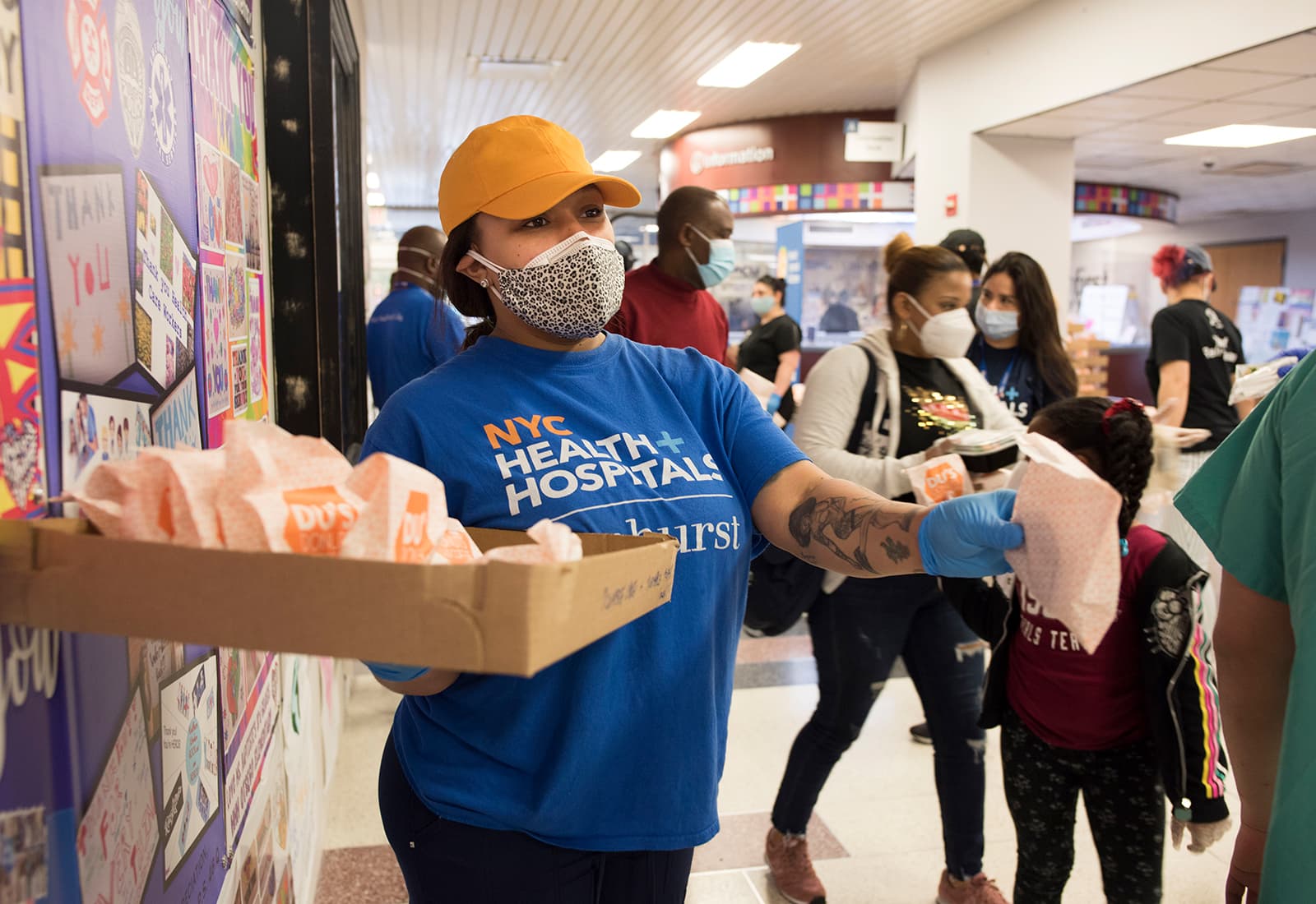 Person hands out meals to frontline workers.