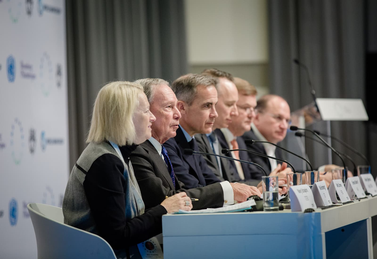 Mike Bloomberg speaks alongside Mary Schapiro and Bank of England Governor Mark Carney during the inaugural One Planet Summit in Paris, France in December 2017.