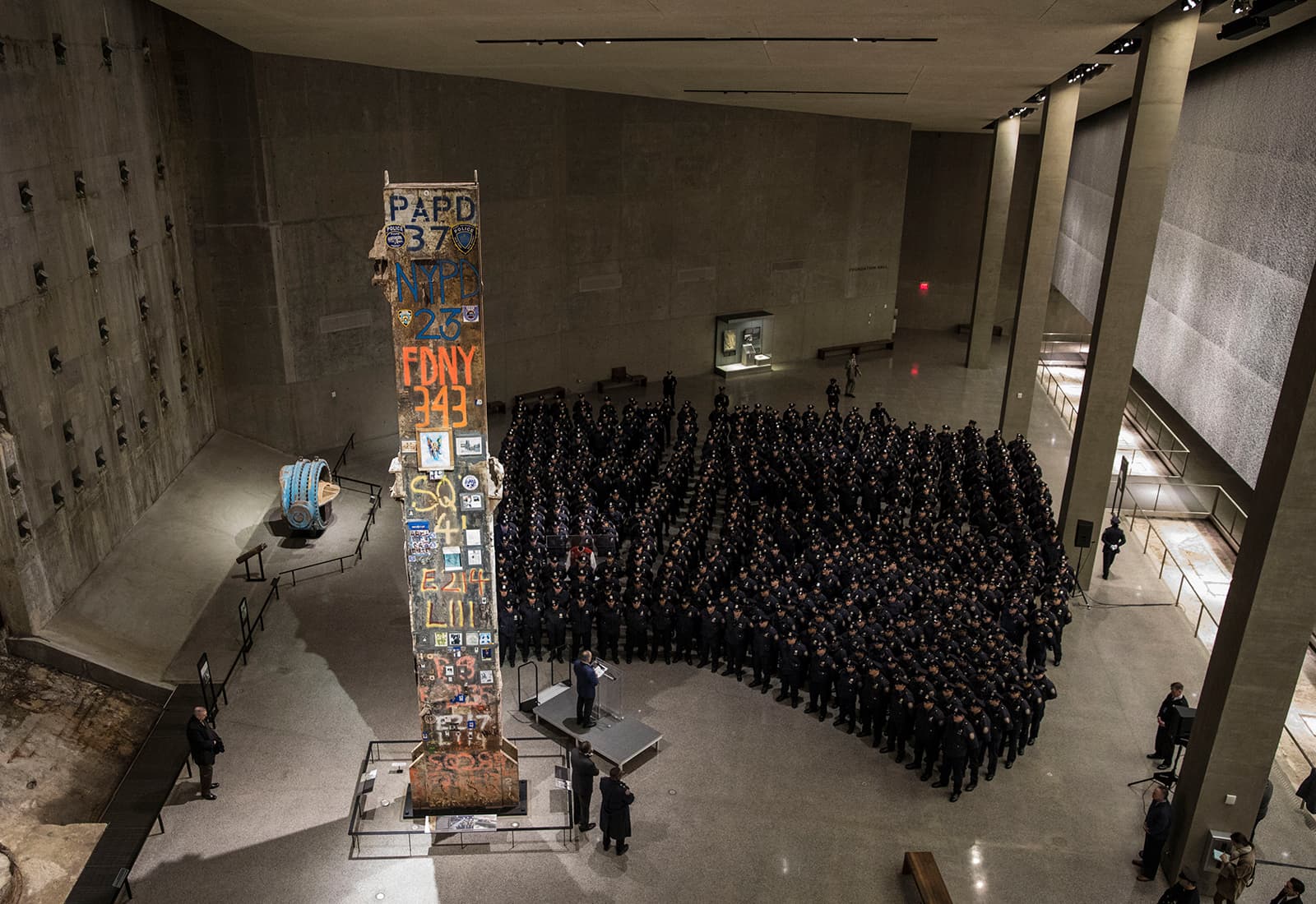 The symbolic “Last Column,” a steel beam from one of the World Trade Center towers, stands near the slurry wall that held back the Hudson River from the site.