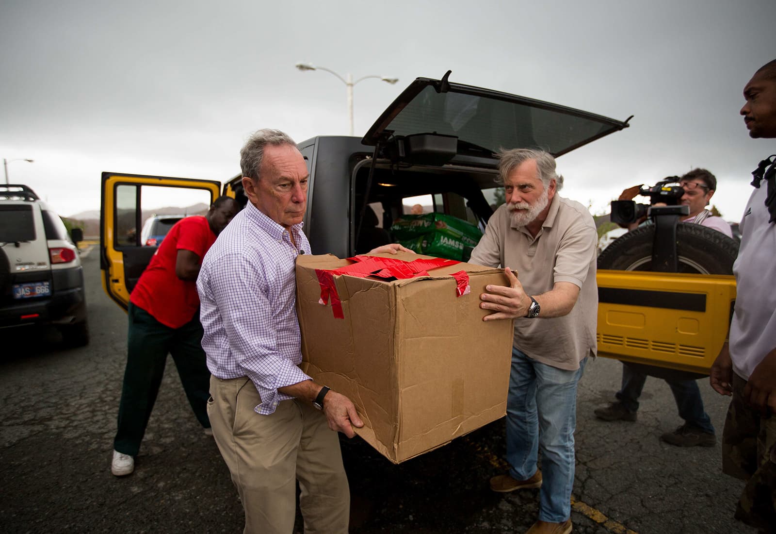 Mike Bloomberg carries boxes of supplies in the U.S. Virgin Islands following the hurricanes of 2017.